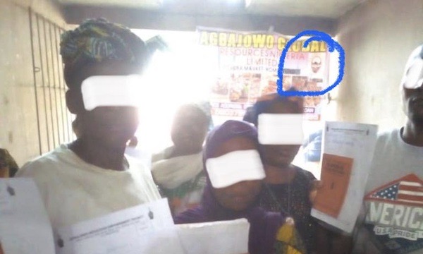Market women holding their Agbajowo fund documents