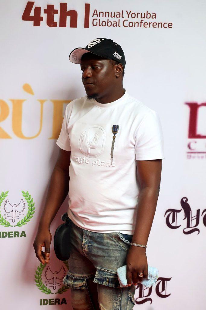 A guest at the conference backdrop at the 4th Annual Yorùbá Global Conference
