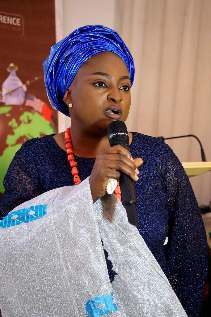 A delegate speaks to the hall at the 4th Annual Yorùbá Global Conference
