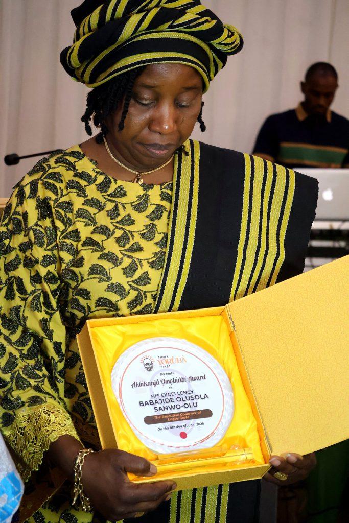 An honoree with her award plaque at the 4th Annual Yorùbá Global Conference
