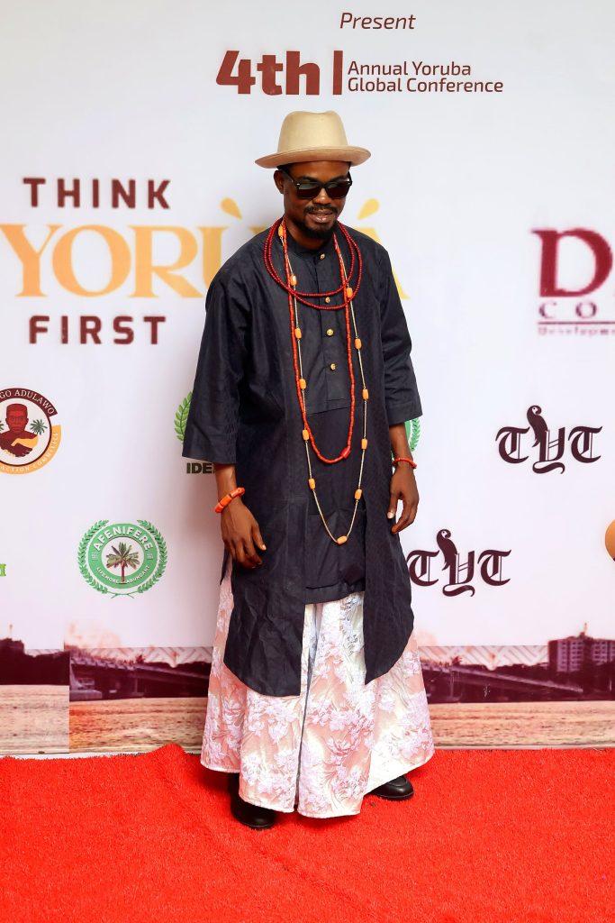 A guest in traditional dress on the red carpet at the 4th Annual Yorùbá Global Conference