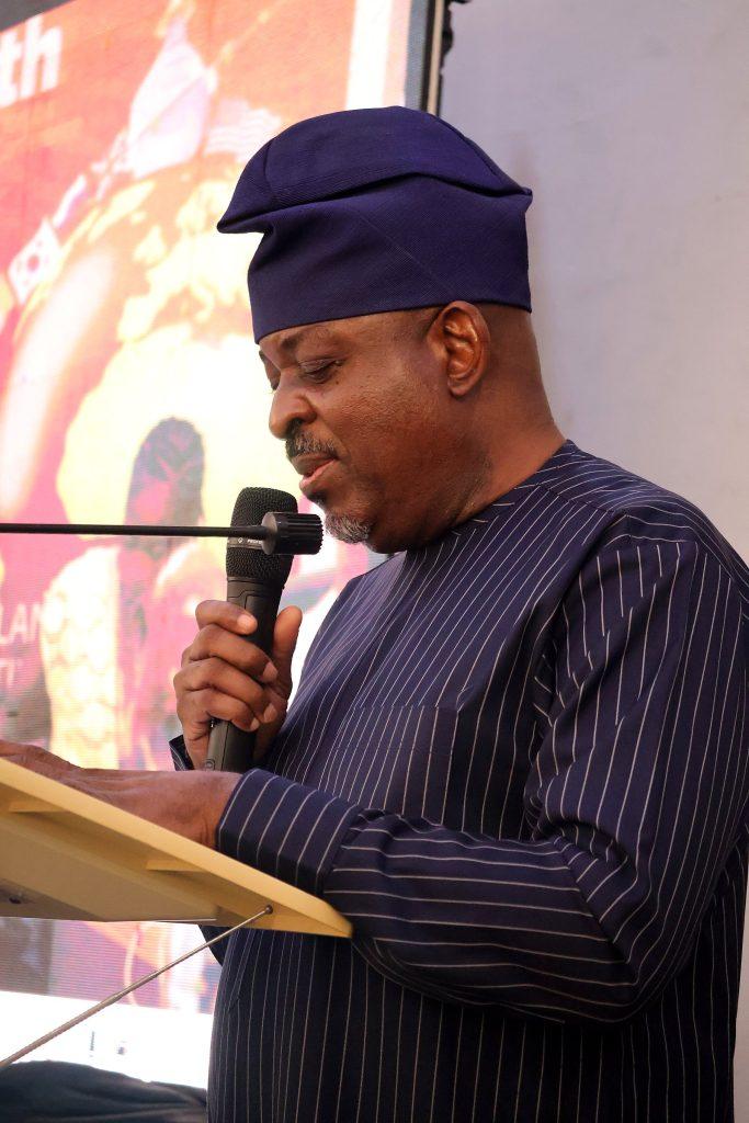 A speaker reads from his notes at the 4th Annual Yorùbá Global Conference